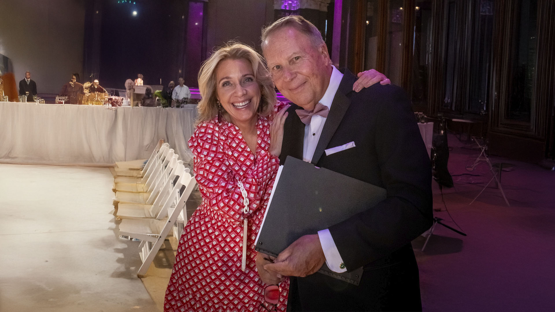 Bettina Alonso with a guest at a black-tie fundraising dinner
